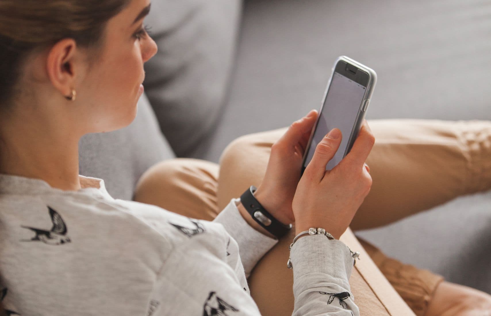 A woman using her phone.