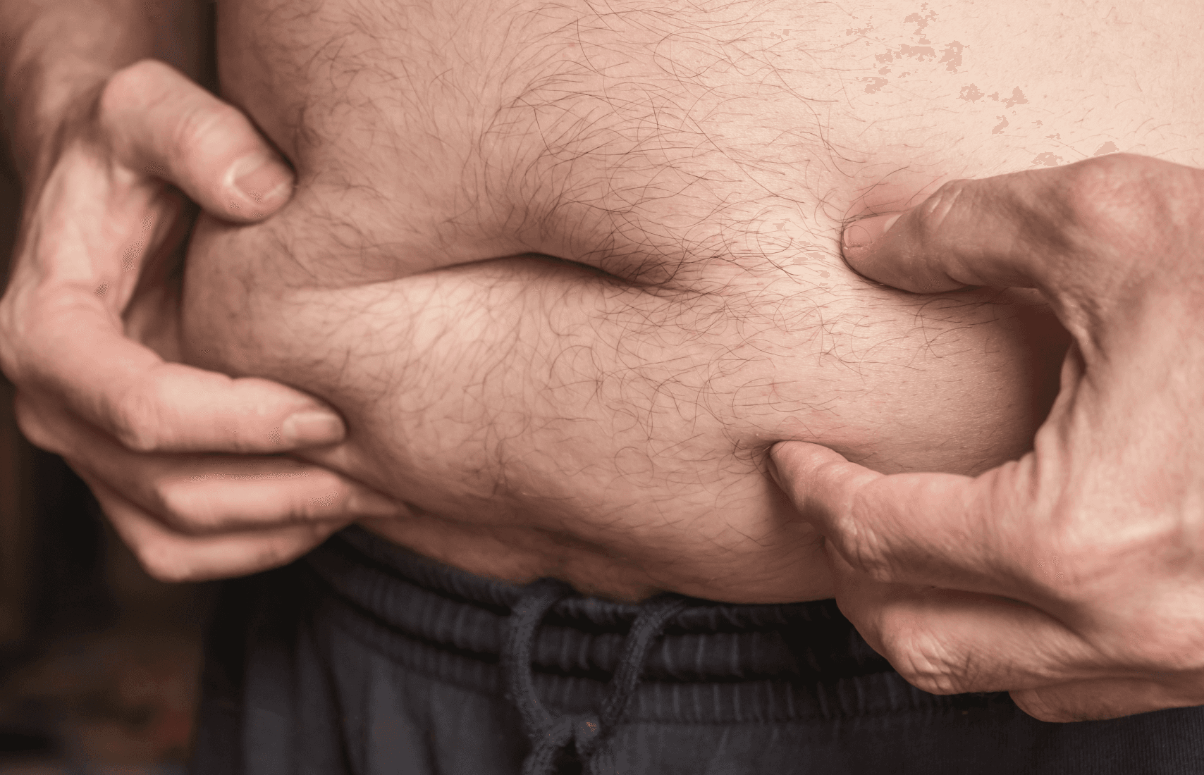 A man holding his belly.